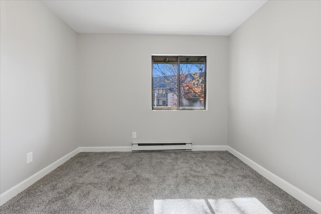 800 Bearses Way, Unit 2SB Barnstable, MA 02601 - Photo 32 of 40 an empty room with a window