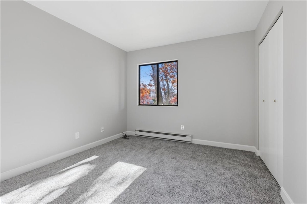 800 Bearses Way, Unit 2SB Barnstable, MA 02601 - Photo 33 of 40 an empty room with a window