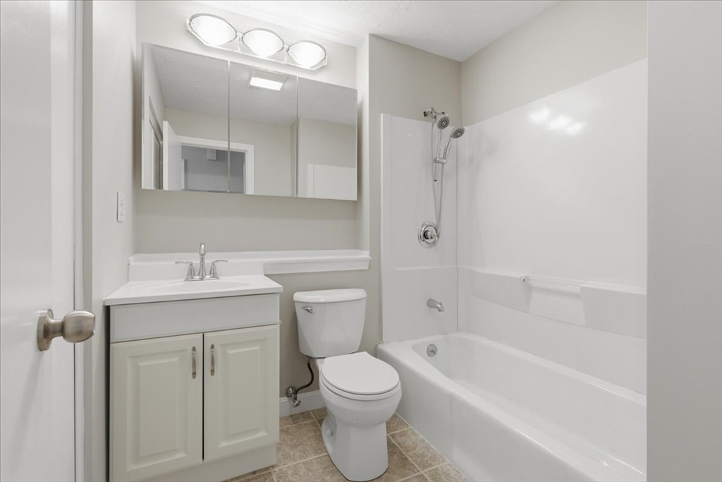 800 Bearses Way, Unit 2SB Barnstable, MA 02601 - Photo 37 of 40 a bathroom with a toilet sink vanity tub and shower