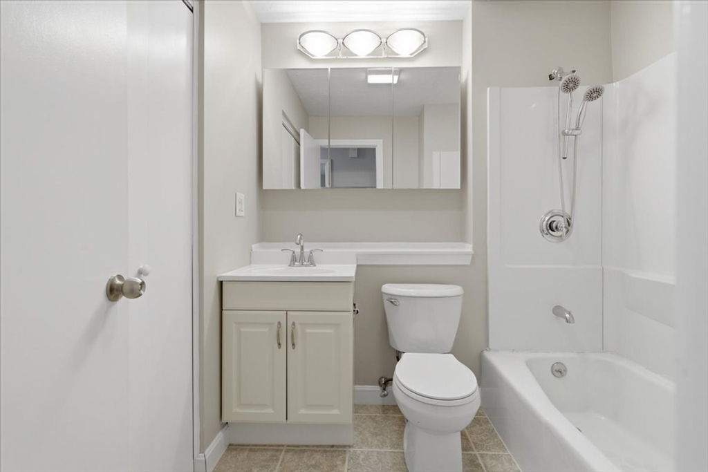 800 Bearses Way, Unit 2SB Barnstable, MA 02601 - Photo 38 of 40 a bathroom with a toilet sink and mirror