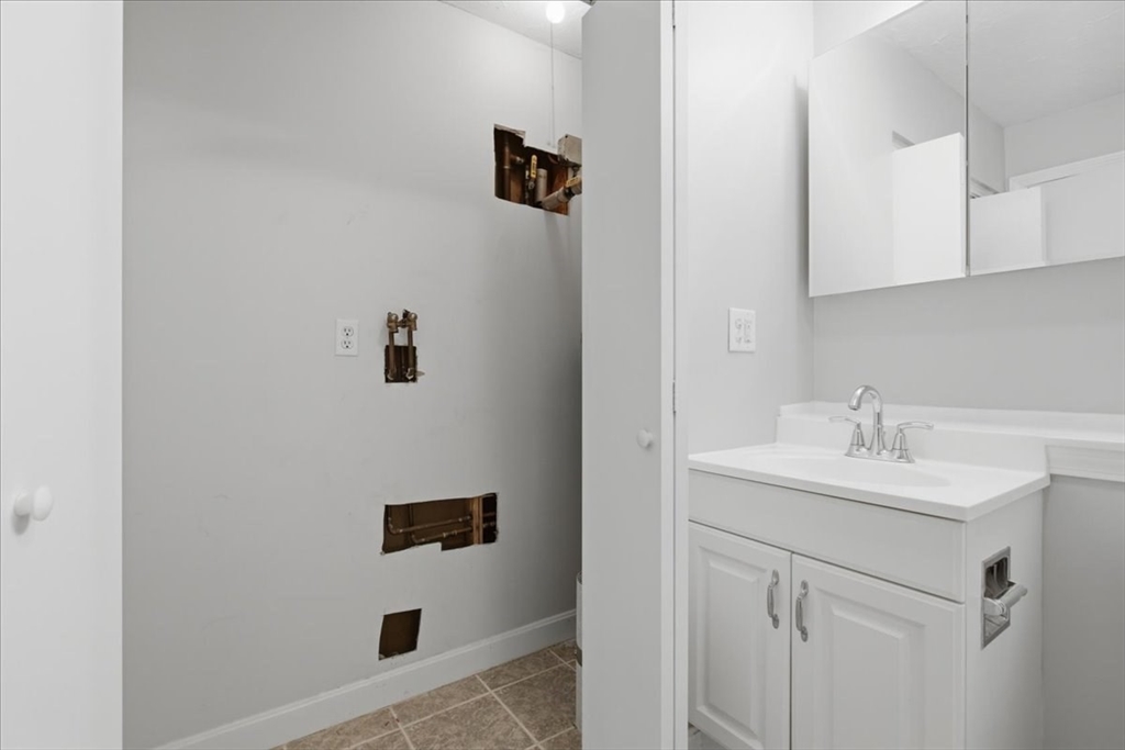 800 Bearses Way, Unit 2SB Barnstable, MA 02601 - Photo 39 of 40 a bathroom with a sink a mirror and shower