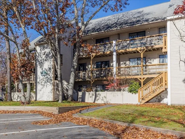 a view of a balcony with a glass door