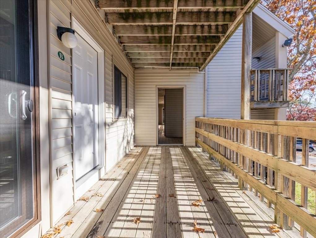 800 Bearses Way, Unit 2SB Barnstable, MA 02601 - Photo 7 of 40 a view of a balcony with wooden floor
