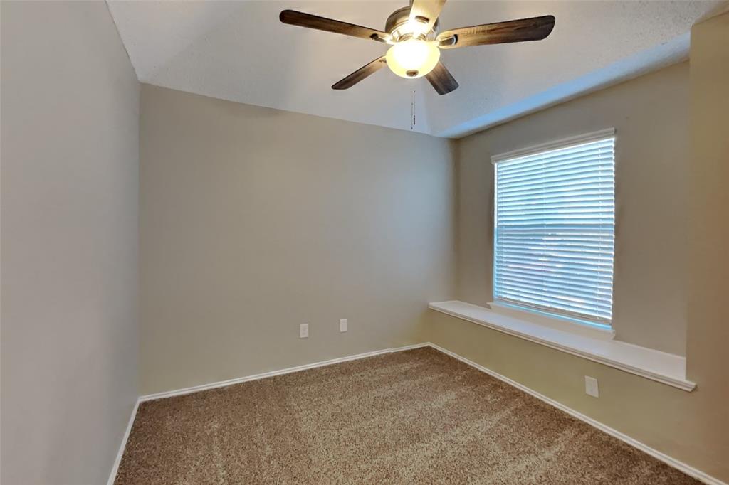 921 Mossberg Lane Mesquite, TX 75181 - Photo 11 of 17 Carpeted empty room with baseboards and ceiling fan
