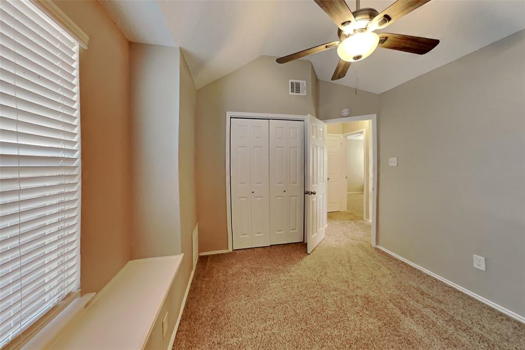 921 Mossberg Lane Mesquite, TX 75181 - Photo 12 of 17 Unfurnished bedroom with lofted ceiling, carpet, a closet, and ceiling fan