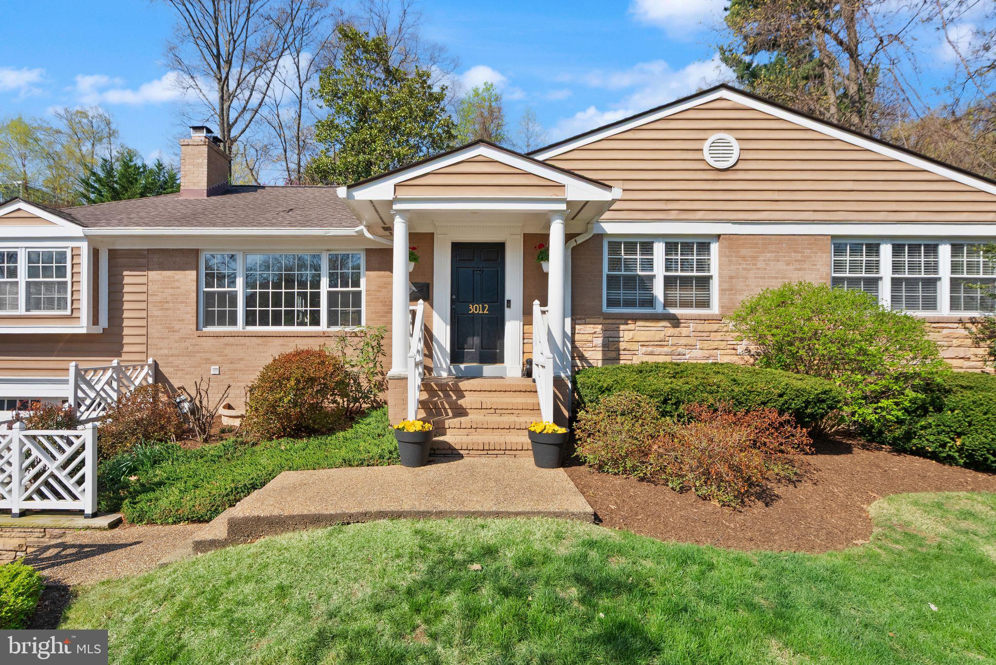 a front view of a house with garden