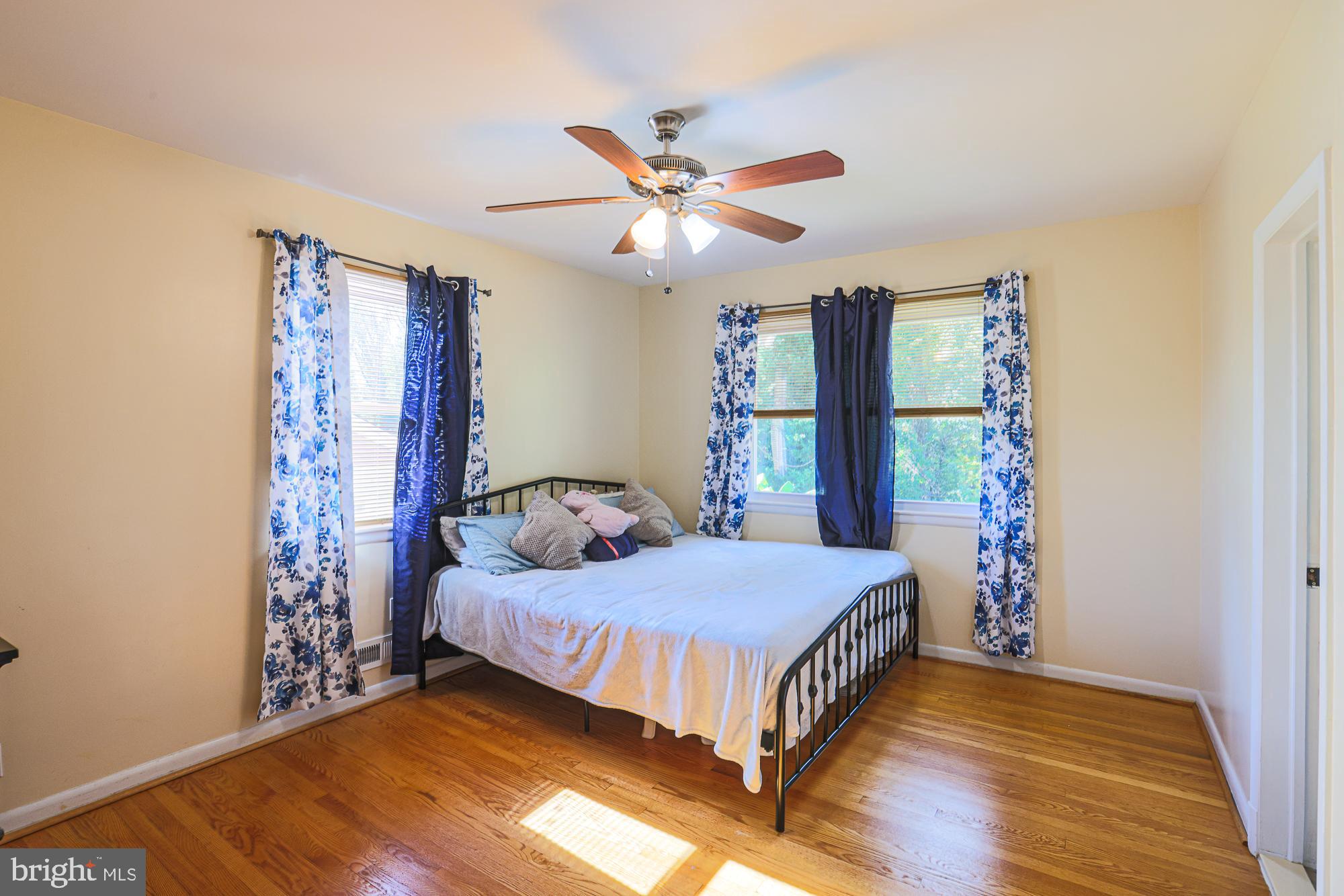 416 Nottingham Road Baltimore, MD 21229 - Photo 15 of 39 a bedroom with a bed and a chandelier