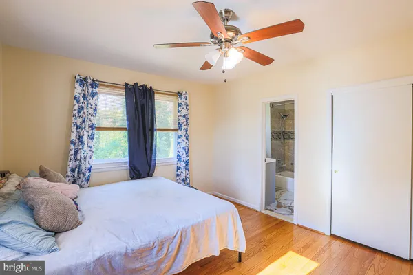 a bedroom with a bed and a walk in closet