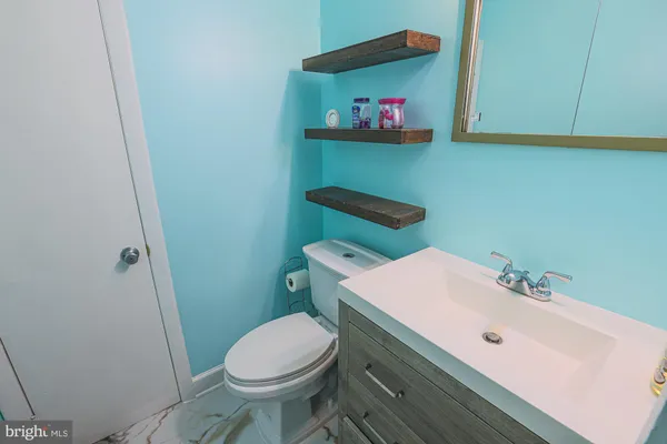 a bathroom with a sink and a toilet