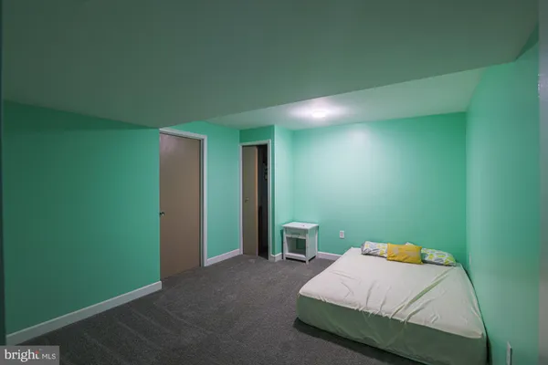 a bedroom with a bed and closet