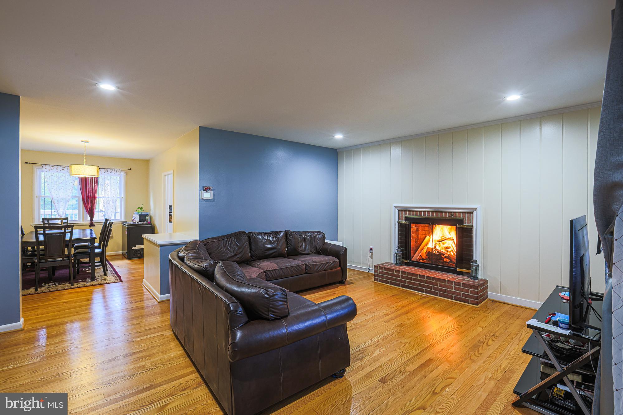 416 Nottingham Road Baltimore, MD 21229 - Photo 3 of 39 a living room with furniture and a flat screen tv