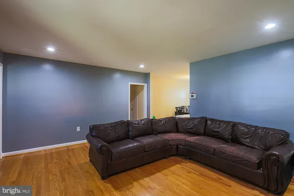 a living room with a couches and painted walls