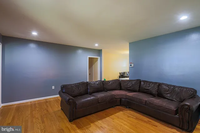 a living room with a couches and painted walls