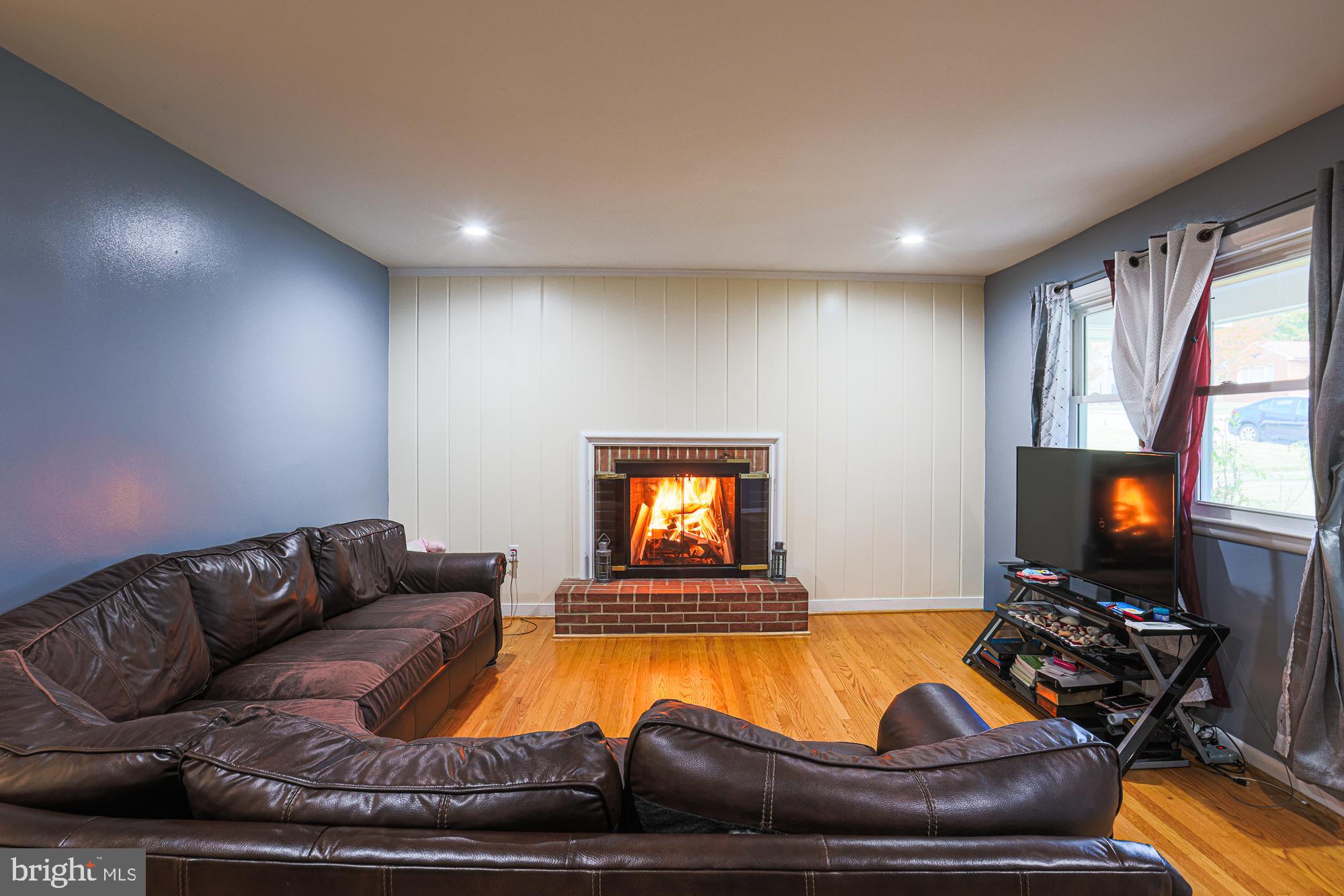 416 Nottingham Road Baltimore, MD 21229 - Photo 5 of 39 a living room with furniture and a flat screen tv