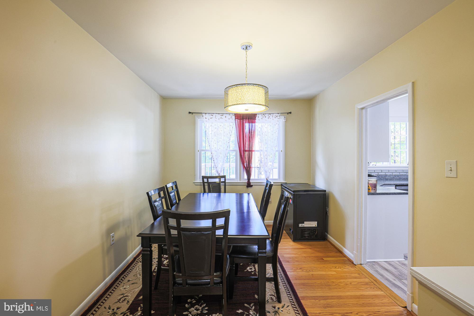 416 Nottingham Road Baltimore, MD 21229 - Photo 7 of 39 a view of a dining room with furniture window and wooden floor