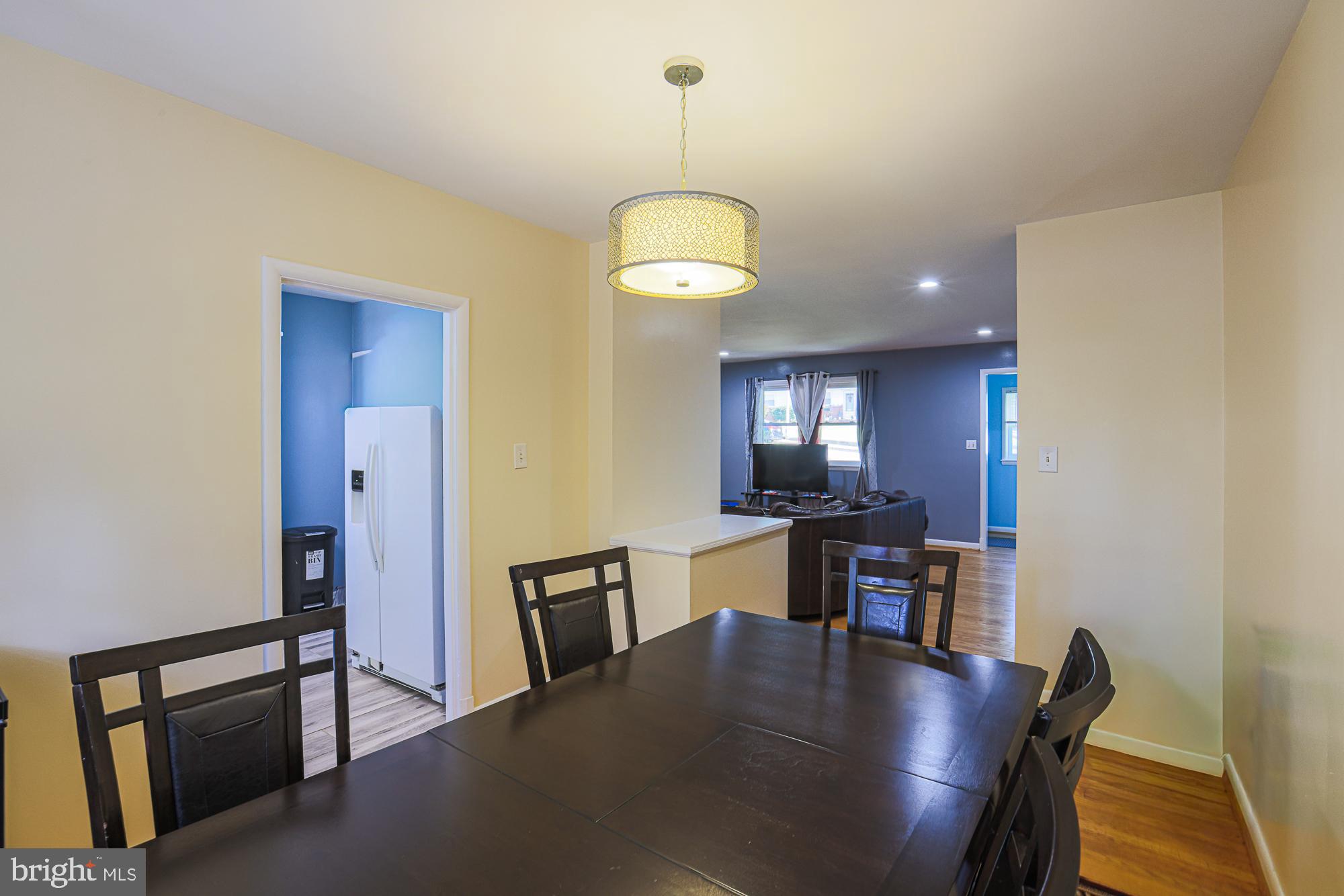 416 Nottingham Road Baltimore, MD 21229 - Photo 9 of 39 a view of a dining room with furniture and wooden floor