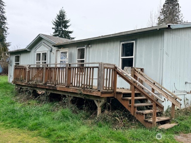 1017 C Street Vader, WA 98593 - Photo 2 of 16 a view of a house with pool and deck