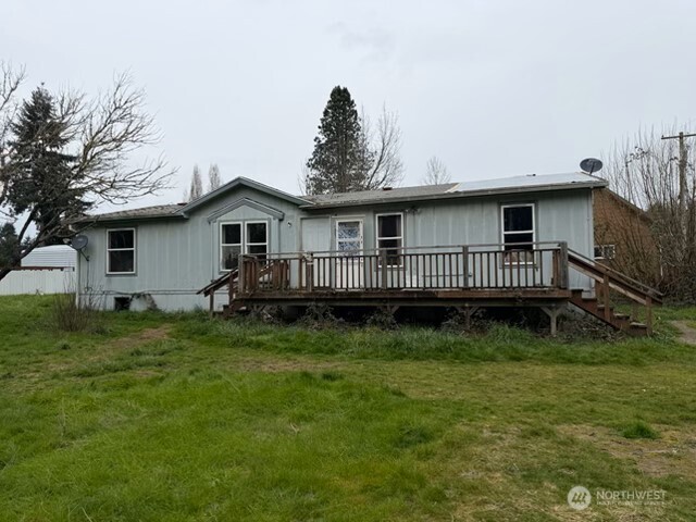 1017 C Street Vader, WA 98593 - Photo 4 of 16 a view of a house with a yard and deck