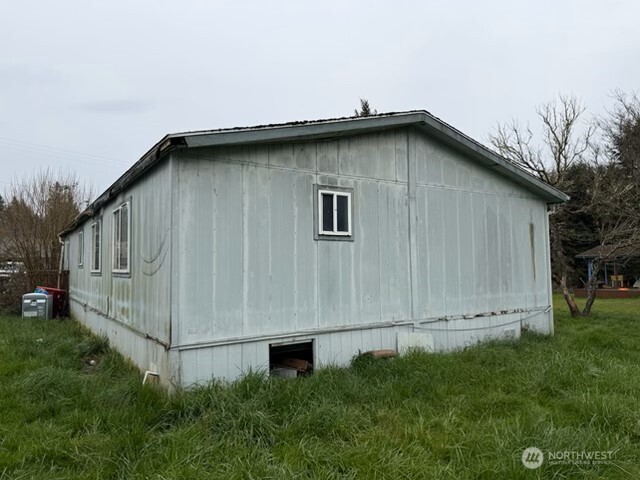 1017 C Street Vader, WA 98593 - Photo 6 of 16 a view of a house with a yard