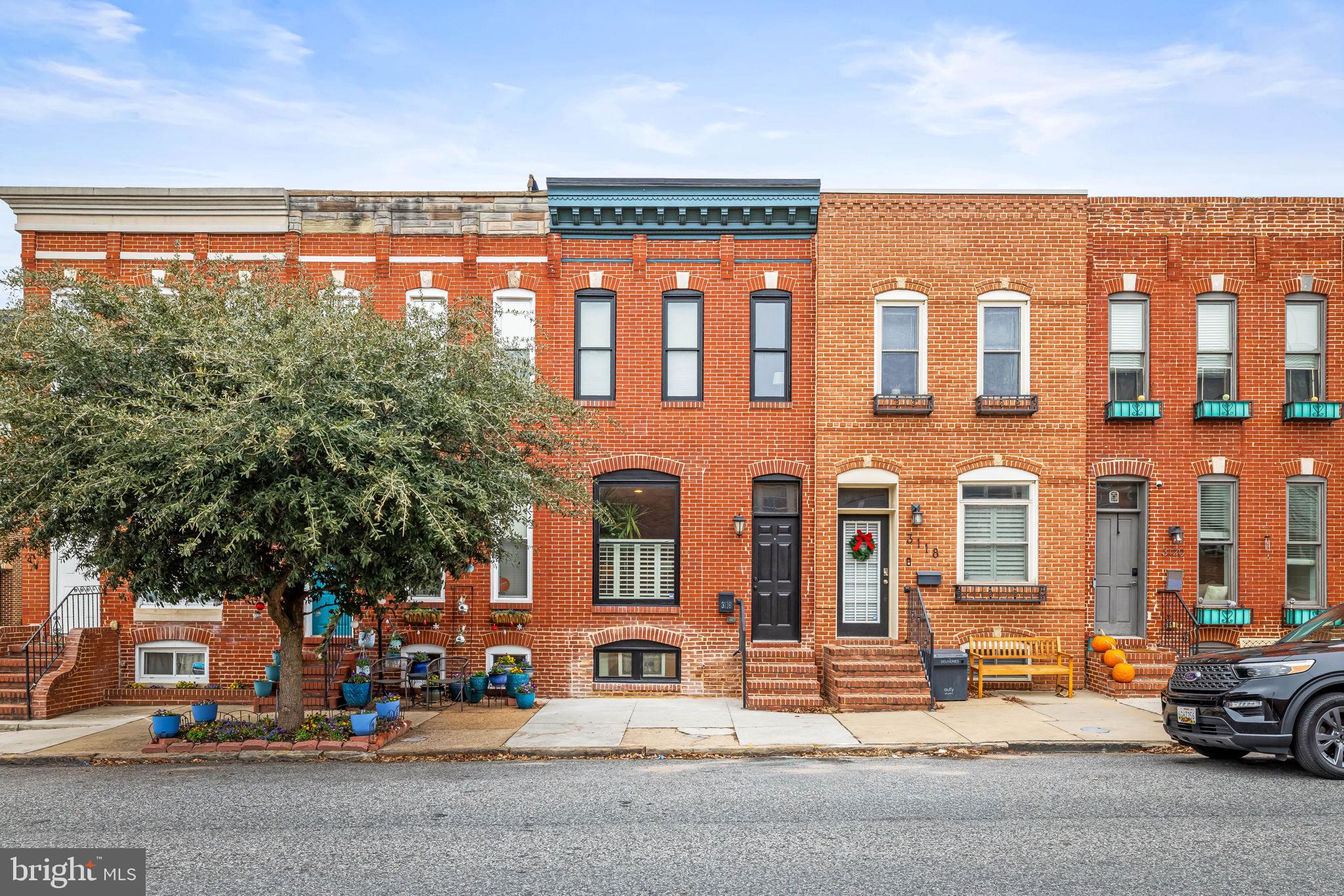 3116 Hudson Street Baltimore, MD 21224 - Photo 1 of 39 a view of a building with car parked on the road