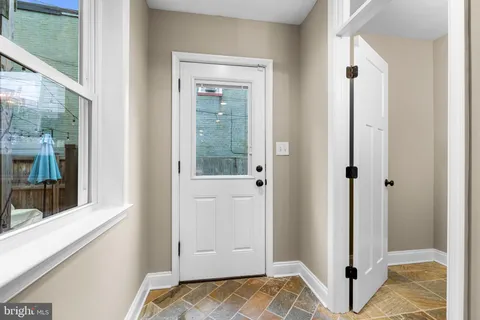 a view of walk in closet with window