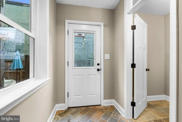 a view of walk in closet with window