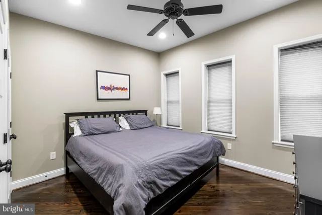 a bedroom with a large bed and a window