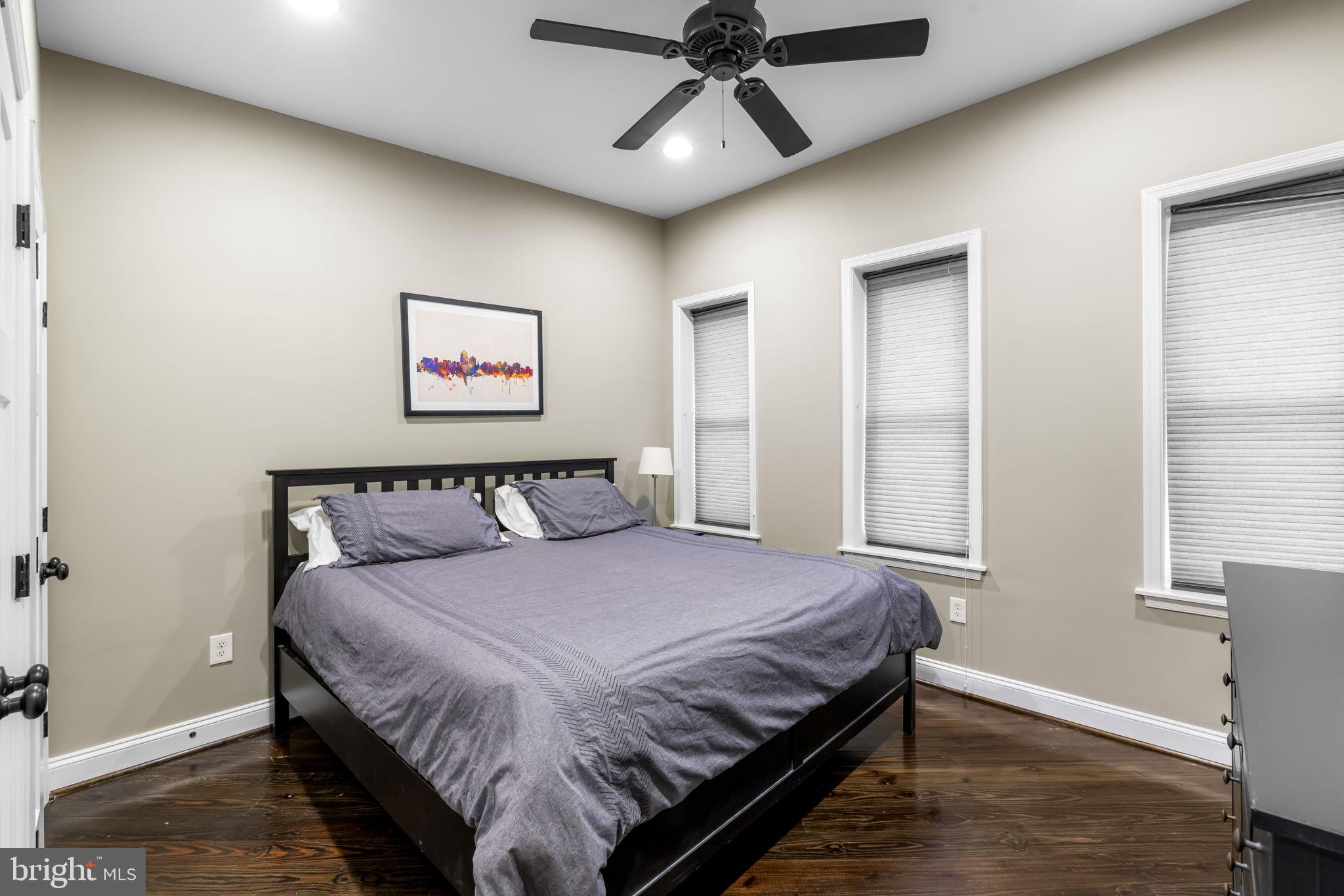 3116 Hudson Street Baltimore, MD 21224 - Photo 22 of 39 a bedroom with a large bed and a window