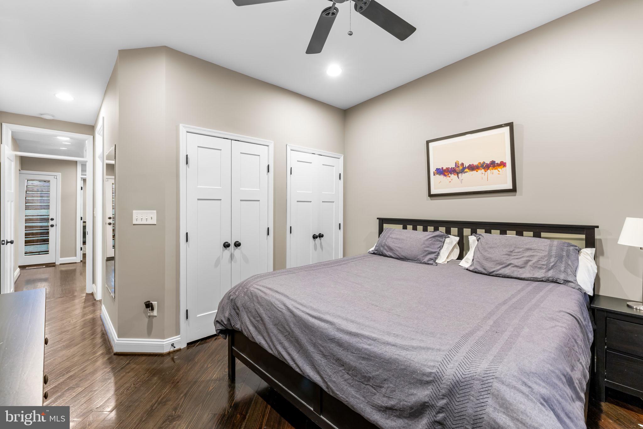 3116 Hudson Street Baltimore, MD 21224 - Photo 23 of 39 a bedroom with a bed and wooden floor