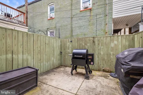 a view of a balcony with chair and table