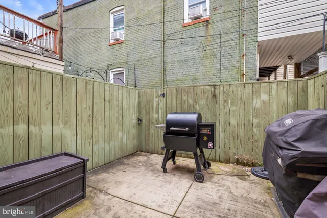 a view of a balcony with chair and table