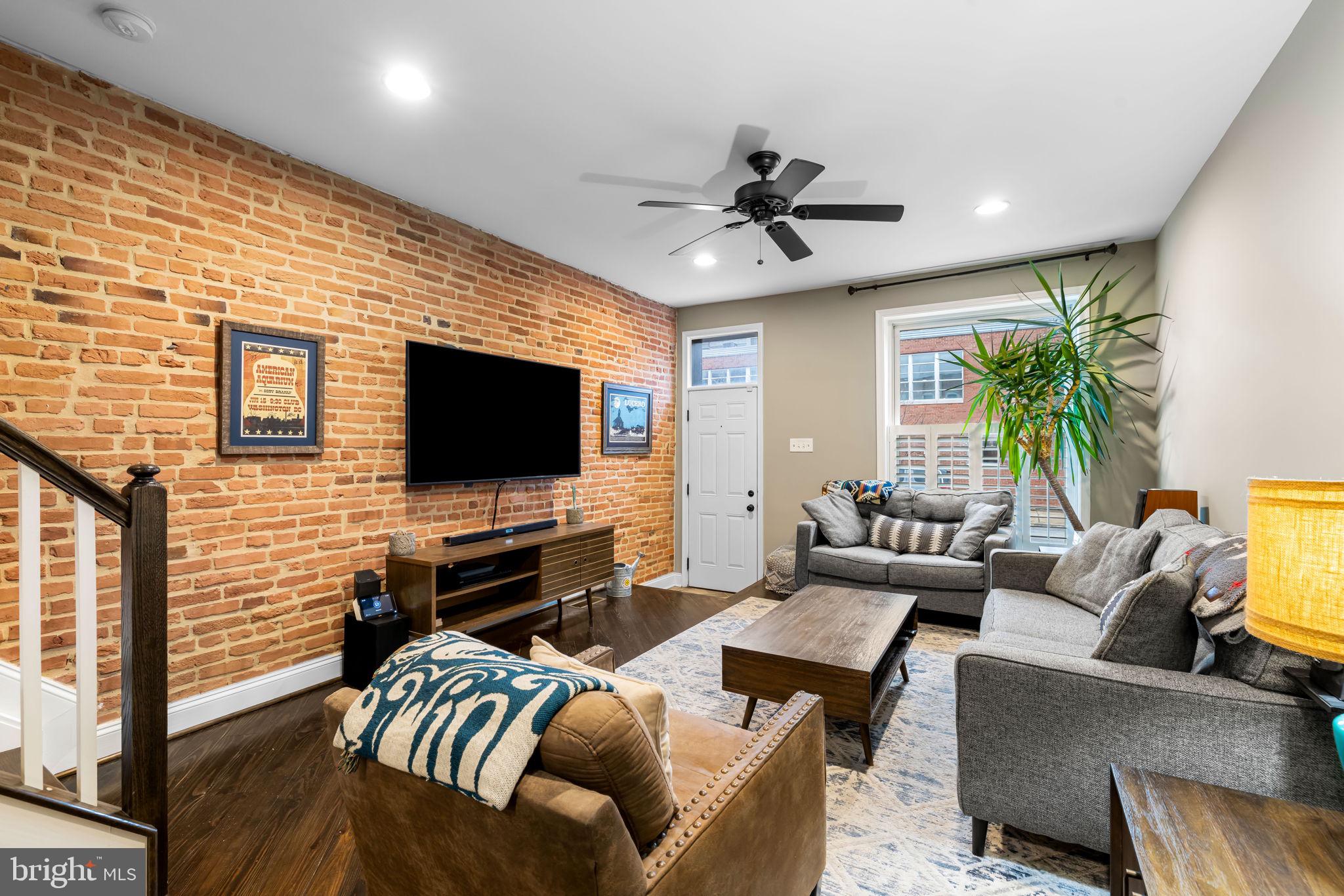3116 Hudson Street Baltimore, MD 21224 - Photo 5 of 39 a living room with furniture and a flat screen tv