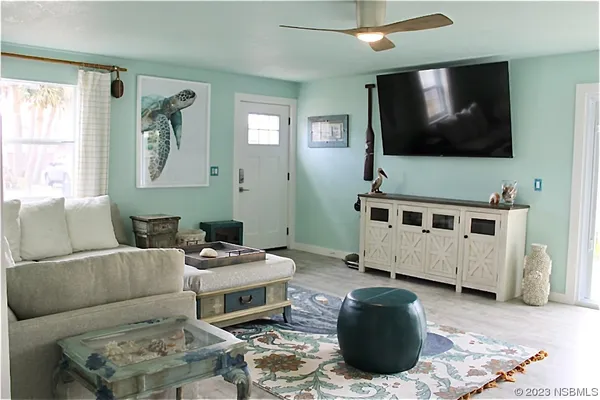 a living room with furniture and a flat screen tv