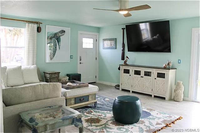a living room with furniture and a flat screen tv