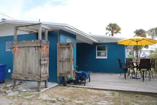 a patio with table and chairs