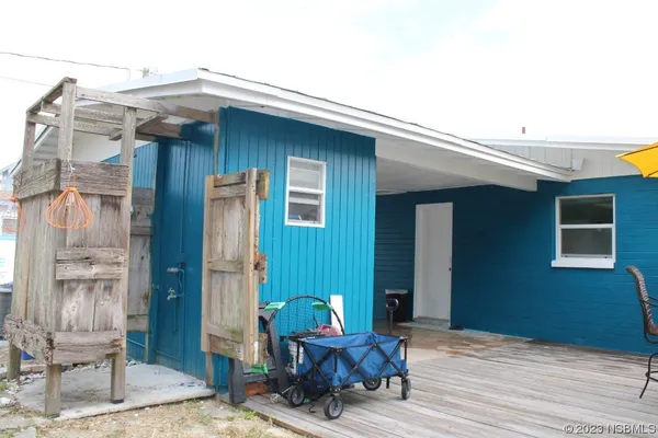 a patio with table and chairs
