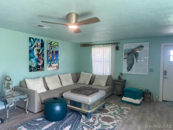 a living room with furniture and a rug