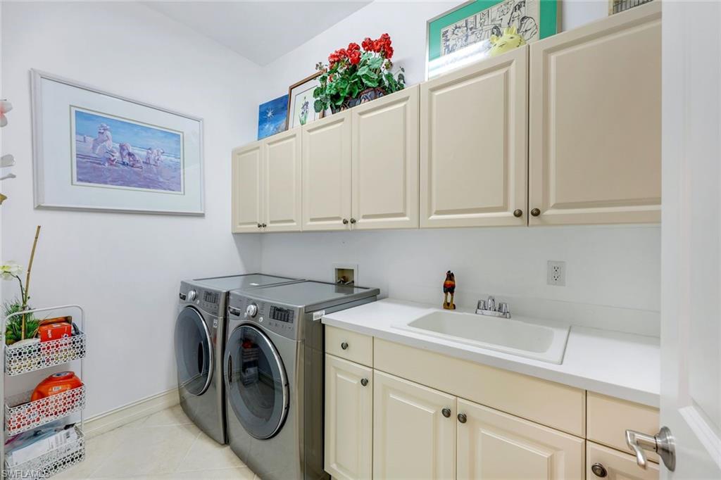 8993 Crooked Stick Court Naples, FL 34113 - Photo 13 of 24 a utility room with sink dryer and washer