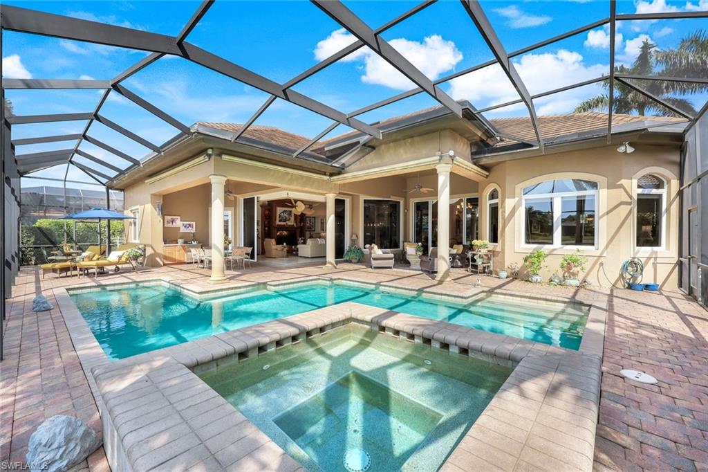 8993 Crooked Stick Court Naples, FL 34113 - Photo 16 of 24 a view of swimming pool with outdoor seating
