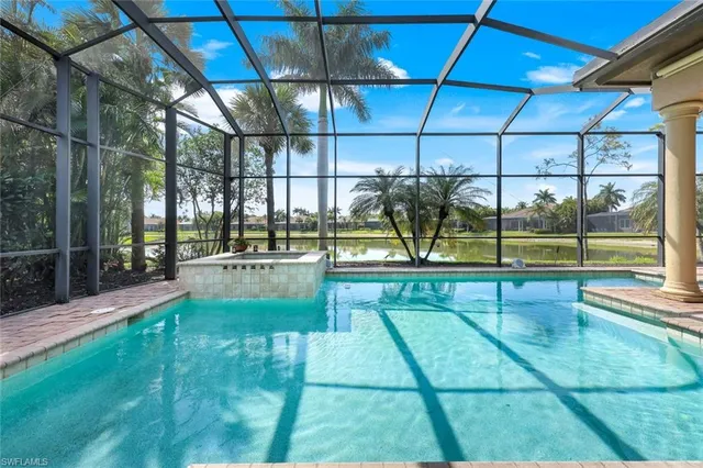 a view of a swimming pool with a patio