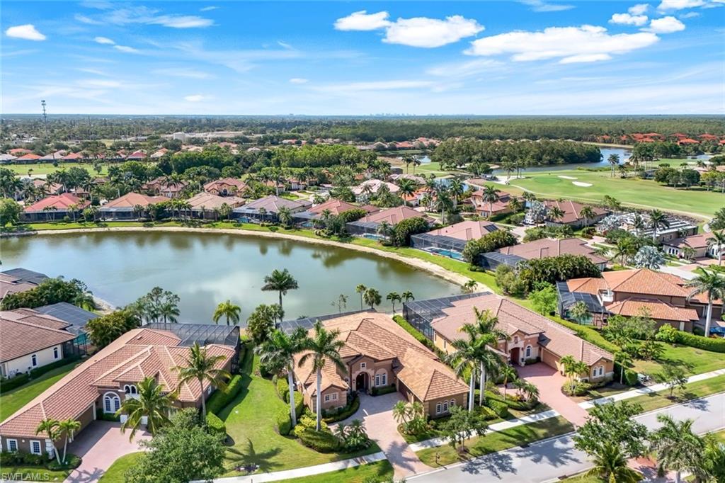 8993 Crooked Stick Court Naples, FL 34113 - Photo 24 of 24 an aerial view of residential houses with outdoor space and ocean view
