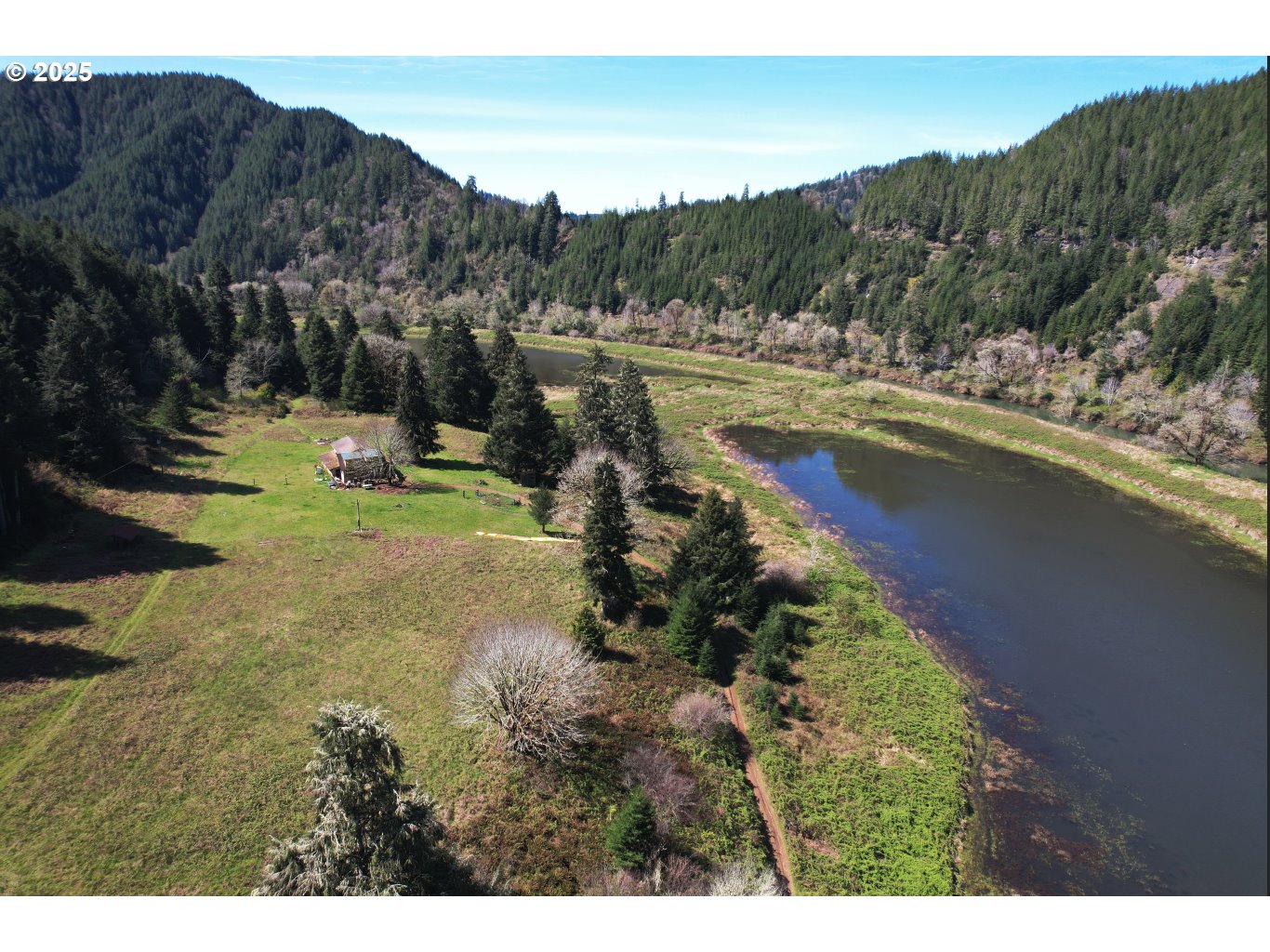 17834 Lower Smith River Road Reedsport, OR 97467 - Photo 4 of 14 a view of a lake with mountain