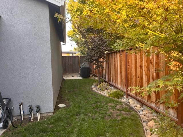 4184 Ivory Lane Turlock, CA 95382 - Photo 11 of 11 a backyard of a house with table and chairs