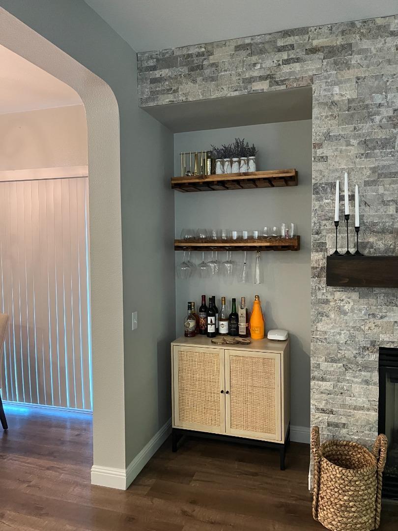 4184 Ivory Lane Turlock, CA 95382 - Photo 3 of 11 a room with lots of bottles of alcohol