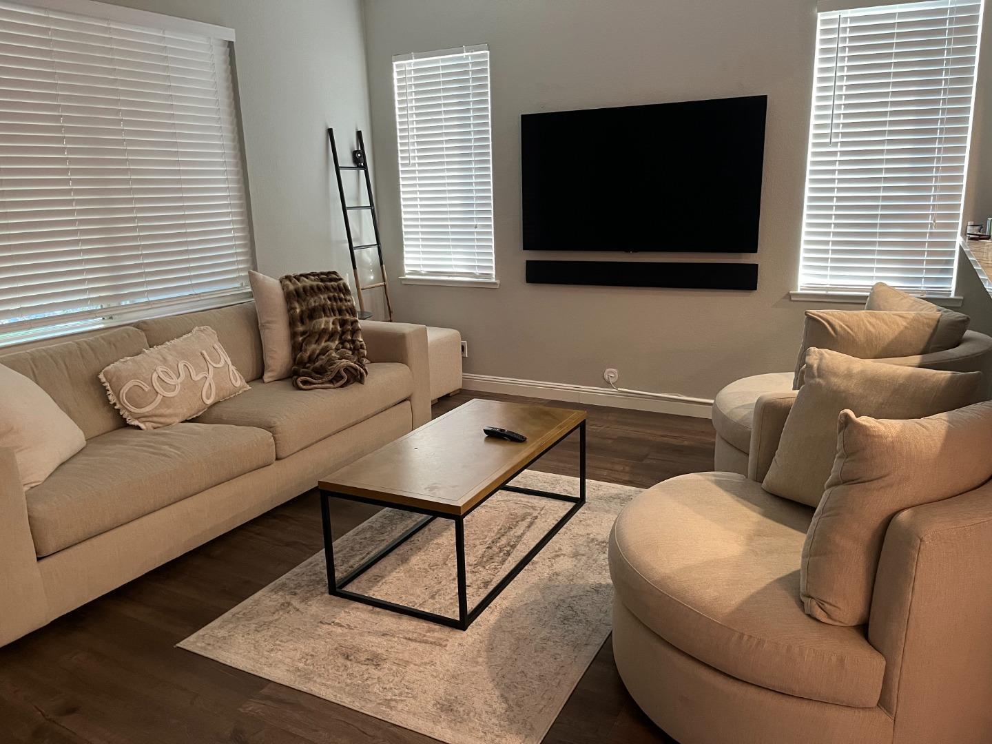 4184 Ivory Lane Turlock, CA 95382 - Photo 6 of 11 a living room with furniture and a flat screen tv