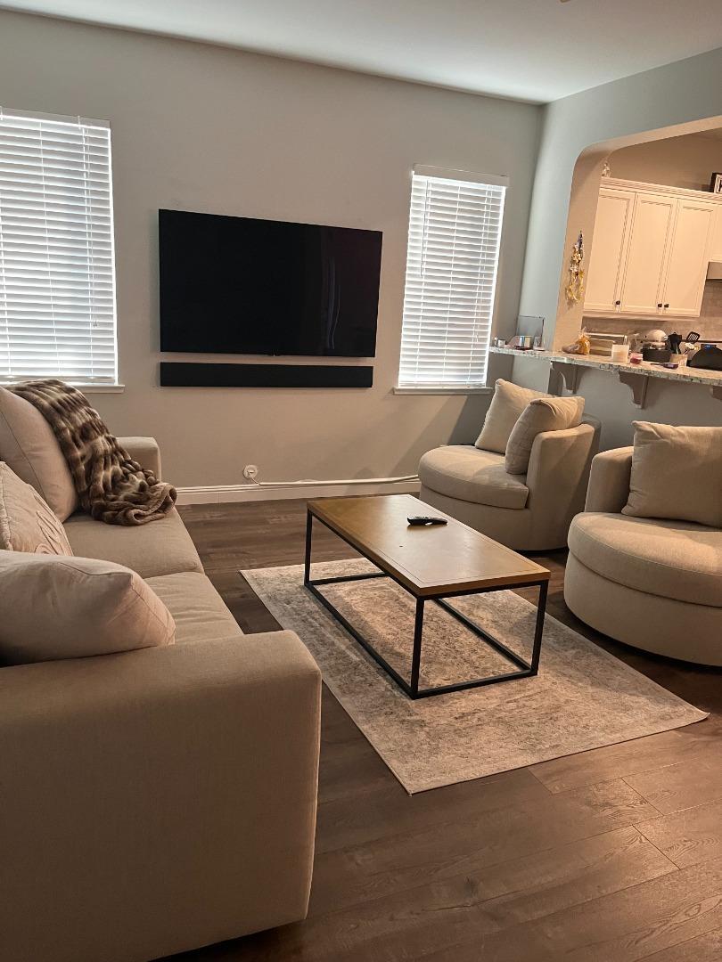 4184 Ivory Lane Turlock, CA 95382 - Photo 7 of 11 a living room with furniture and a flat screen tv