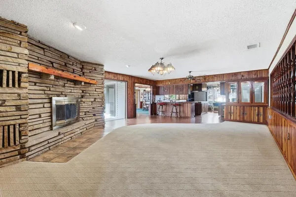 a spacious bedroom with a bed and a fireplace