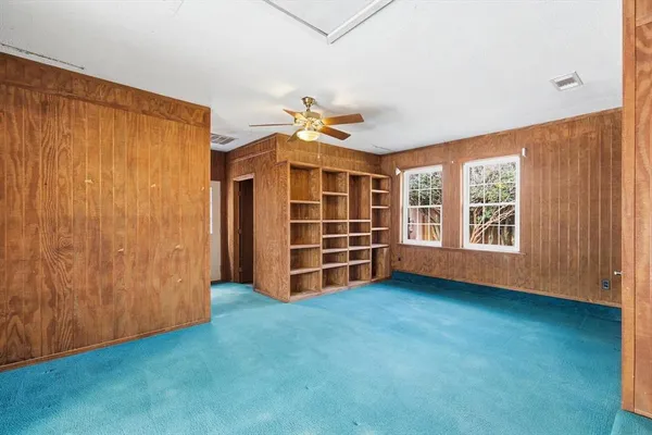 a view of interior space with wooden floor and seating space