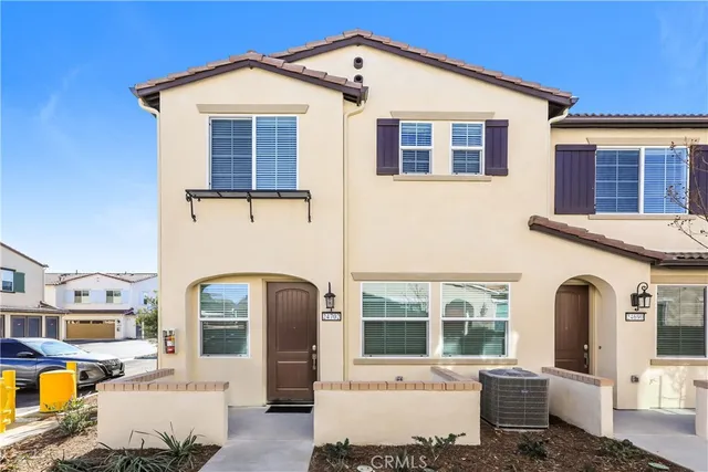 a front view of a house with outdoor space