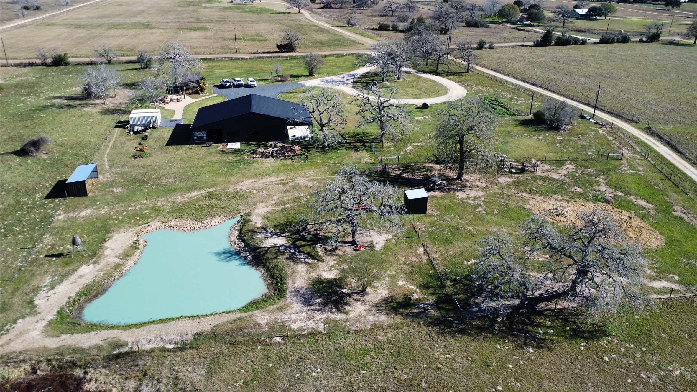 1524 Shaws Bend Road Columbus, TX 78934 - Photo 19 of 19 an aerial view of a house with a yard and lake
